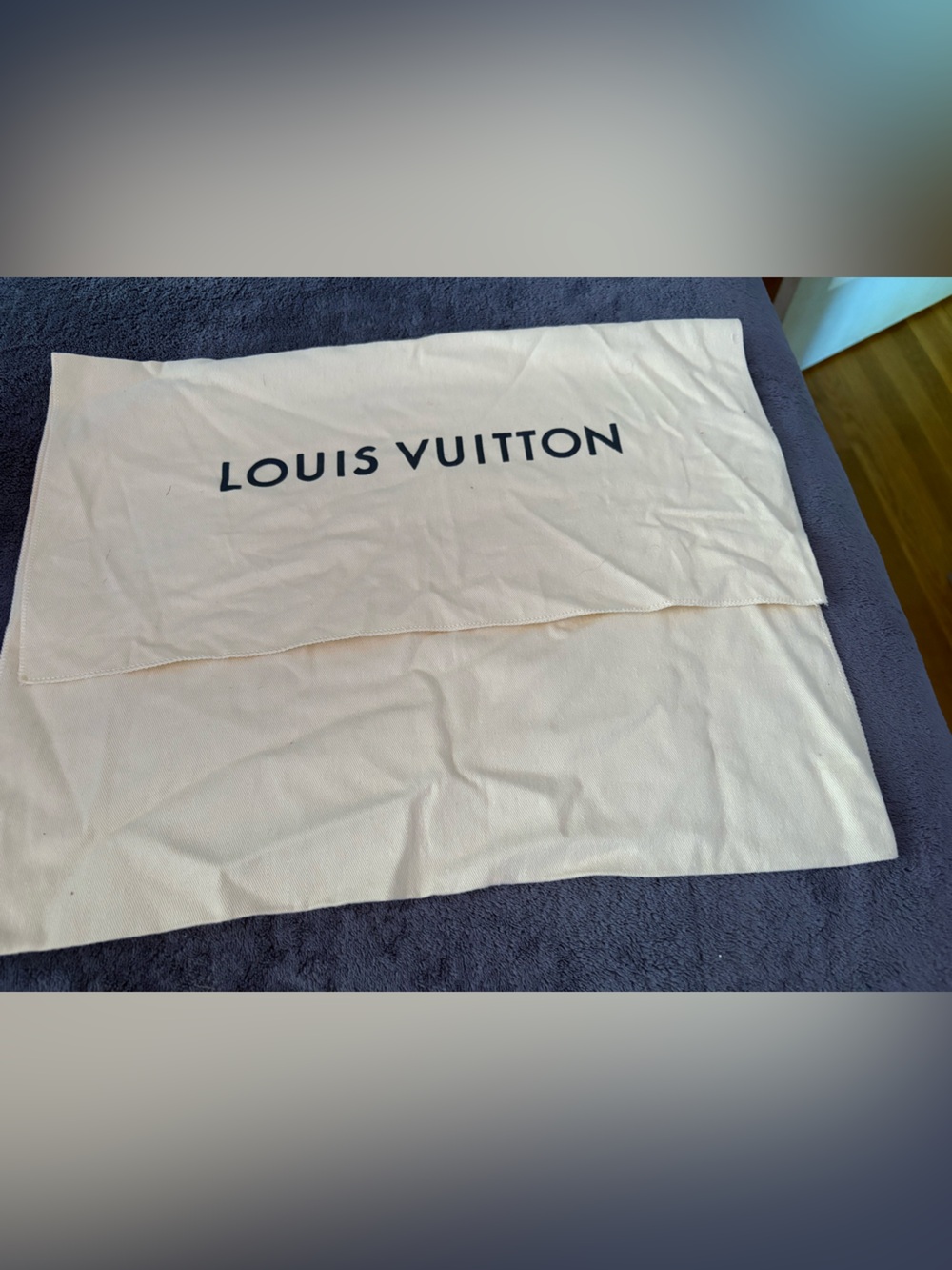 Louis Vuitton cream dust bag with black logo